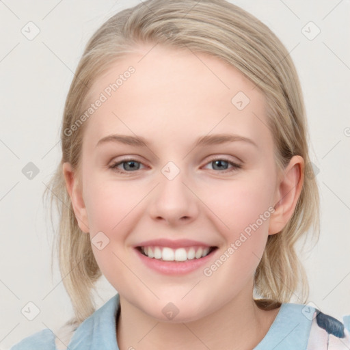 Joyful white child female with medium  brown hair and blue eyes