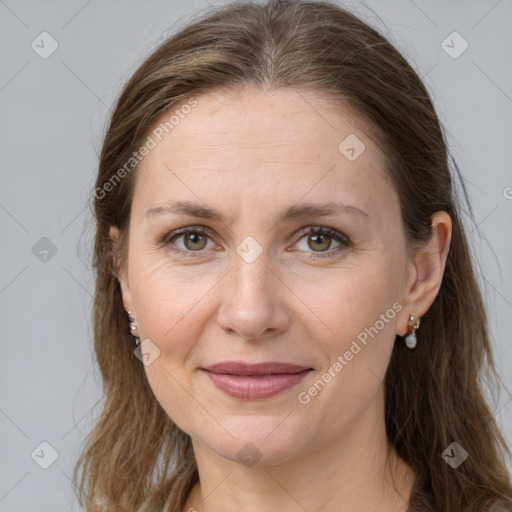 Joyful white adult female with long  brown hair and grey eyes