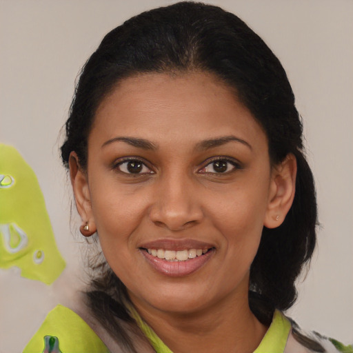 Joyful black young-adult female with medium  brown hair and brown eyes