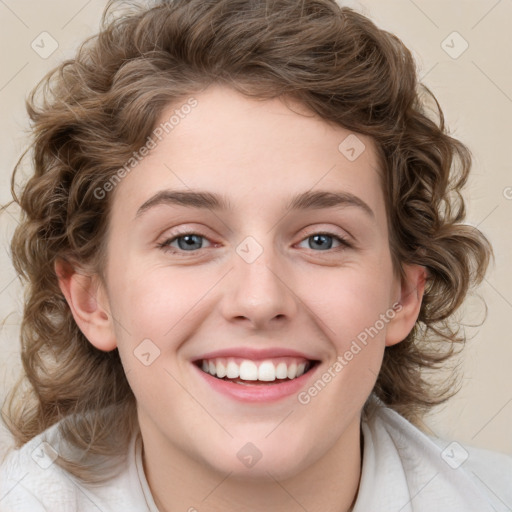 Joyful white young-adult female with medium  brown hair and blue eyes