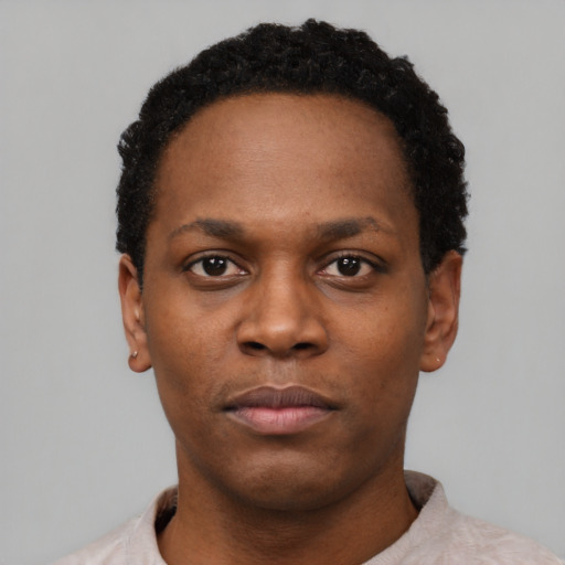 Neutral black young-adult male with short  black hair and brown eyes