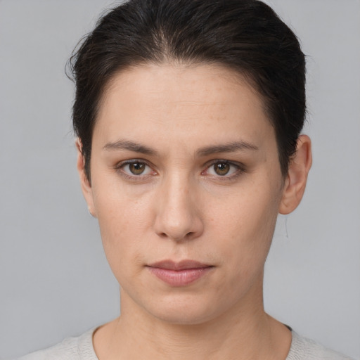 Neutral white young-adult female with short  brown hair and brown eyes