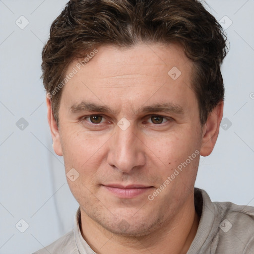 Joyful white adult male with short  brown hair and grey eyes