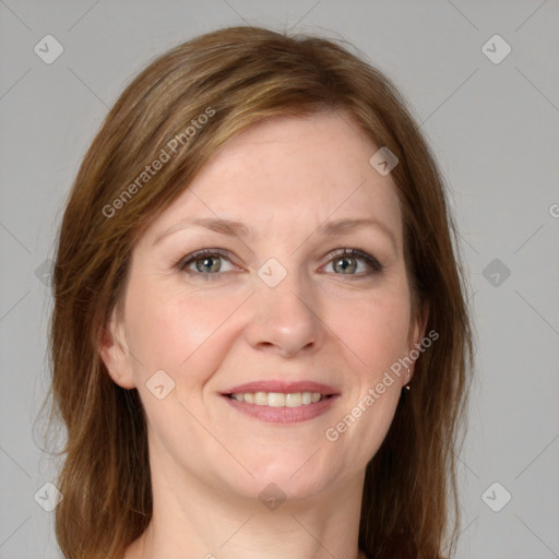 Joyful white young-adult female with medium  brown hair and blue eyes