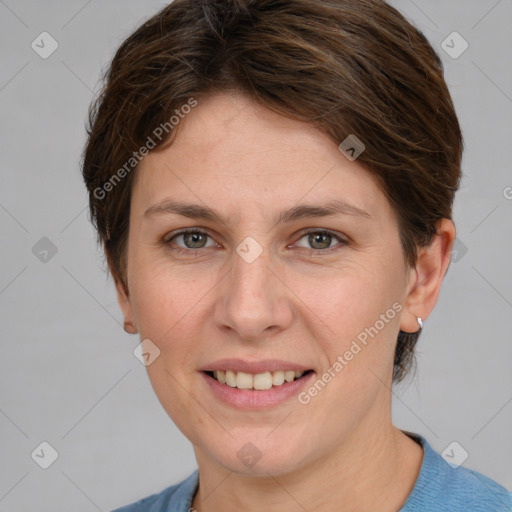 Joyful white young-adult female with medium  brown hair and grey eyes