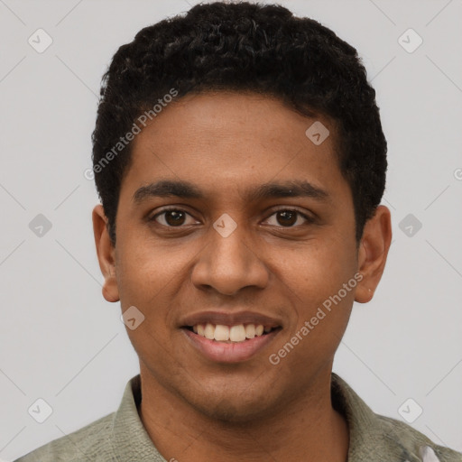 Joyful black young-adult male with short  black hair and brown eyes