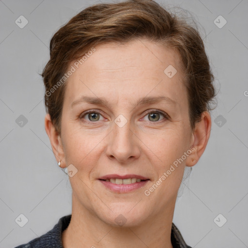 Joyful white adult female with short  brown hair and grey eyes