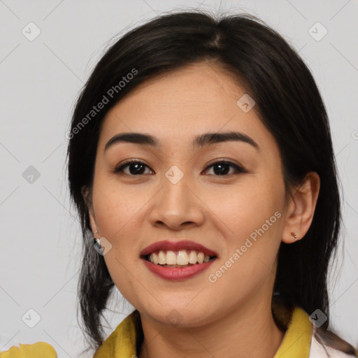 Joyful asian young-adult female with medium  brown hair and brown eyes