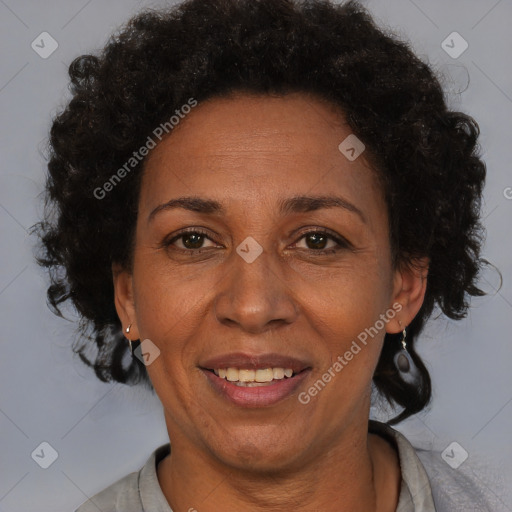 Joyful black adult female with short  brown hair and brown eyes