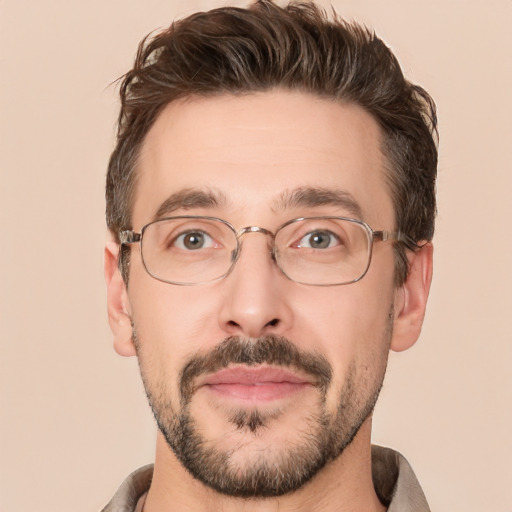 Joyful white adult male with short  brown hair and brown eyes