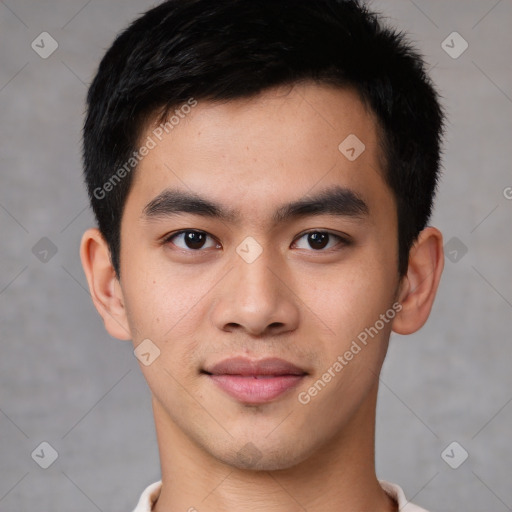 Joyful asian young-adult male with short  brown hair and brown eyes