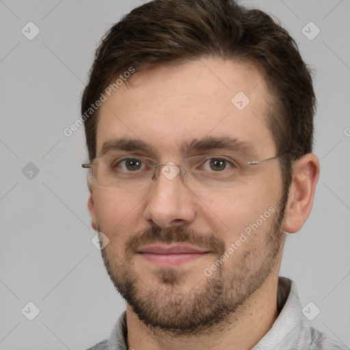 Joyful white adult male with short  brown hair and grey eyes