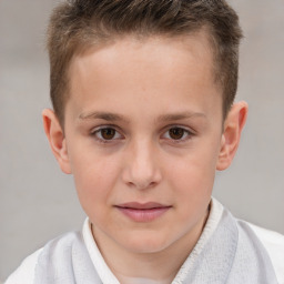 Joyful white child male with short  brown hair and brown eyes