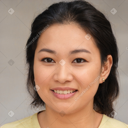 Joyful asian young-adult female with medium  brown hair and brown eyes