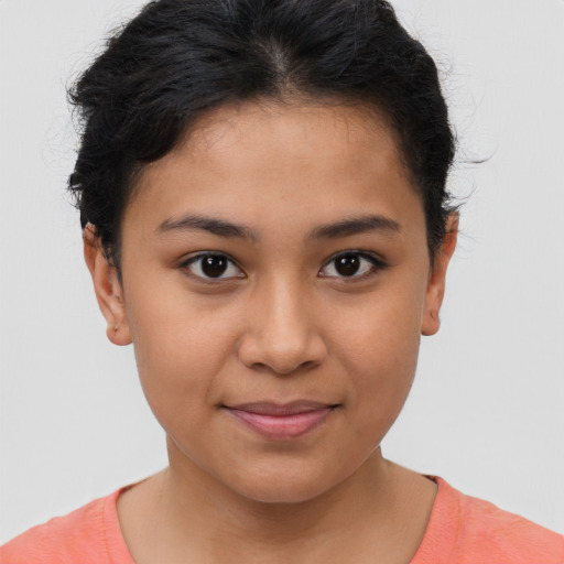 Joyful latino young-adult female with short  brown hair and brown eyes