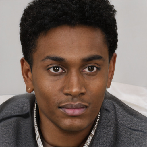 Neutral latino young-adult male with short  brown hair and brown eyes