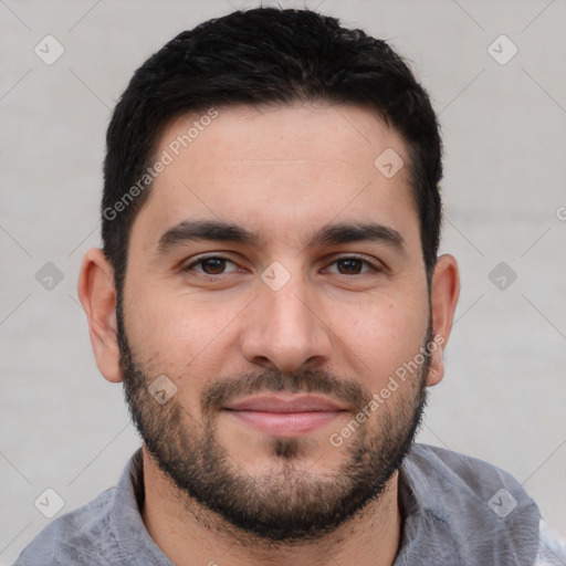 Joyful white young-adult male with short  black hair and brown eyes