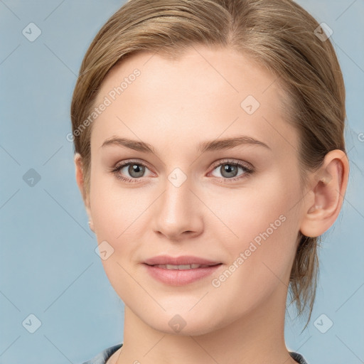 Joyful white young-adult female with medium  brown hair and blue eyes