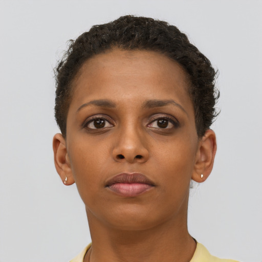 Neutral black young-adult female with short  brown hair and brown eyes