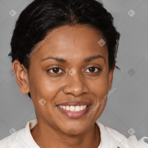 Joyful black young-adult female with short  brown hair and brown eyes