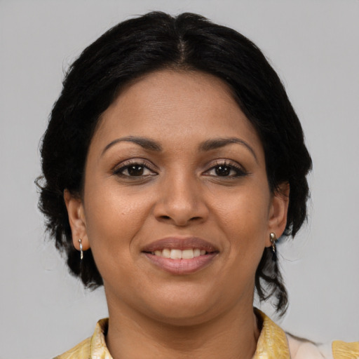 Joyful latino young-adult female with medium  black hair and brown eyes