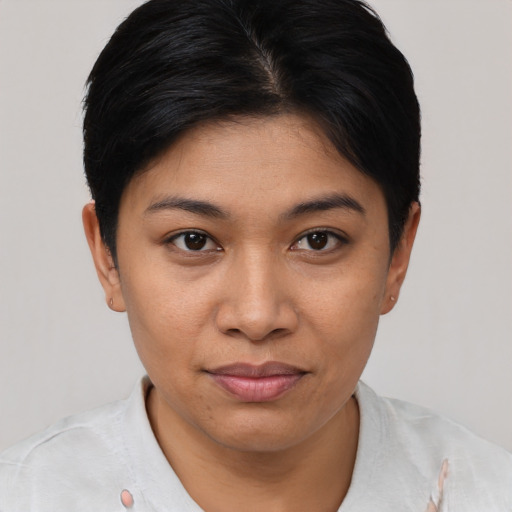 Joyful latino young-adult female with short  brown hair and brown eyes