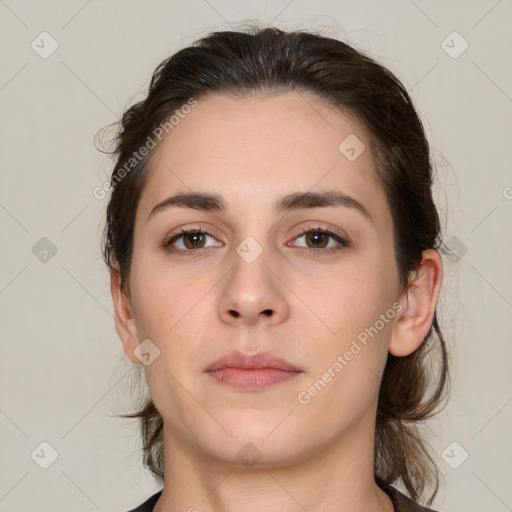 Neutral white young-adult female with medium  brown hair and brown eyes