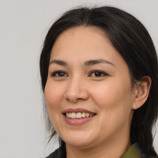 Joyful asian young-adult female with medium  brown hair and brown eyes