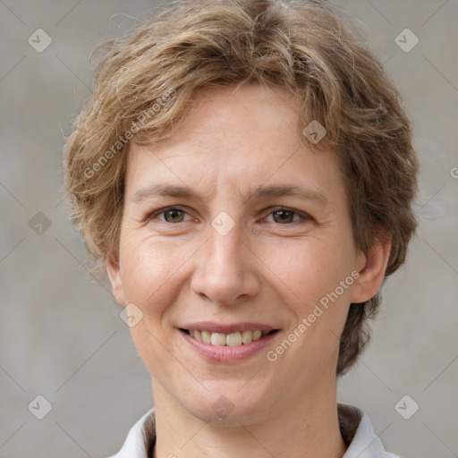 Joyful white adult female with short  brown hair and brown eyes