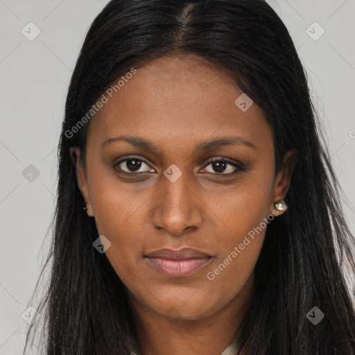 Joyful black young-adult female with long  brown hair and brown eyes