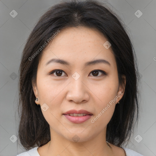 Joyful asian young-adult female with medium  brown hair and brown eyes