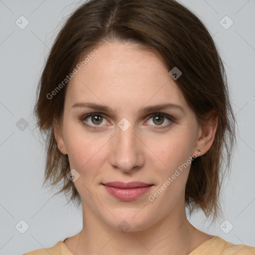 Joyful white young-adult female with medium  brown hair and green eyes