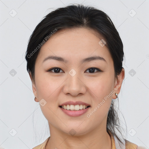 Joyful asian young-adult female with medium  brown hair and brown eyes