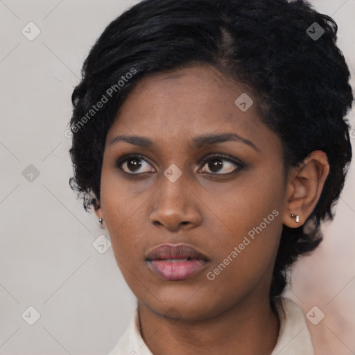 Neutral black young-adult female with short  black hair and brown eyes