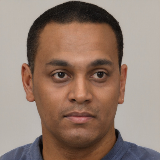 Neutral latino young-adult male with short  brown hair and brown eyes