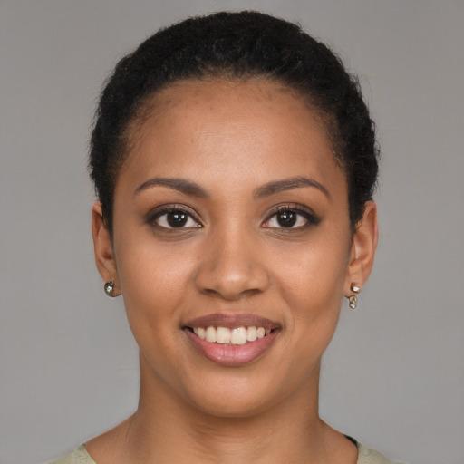 Joyful black young-adult female with short  brown hair and brown eyes