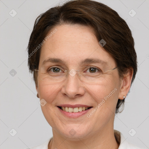 Joyful white adult female with medium  brown hair and grey eyes