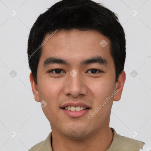 Joyful asian young-adult male with short  black hair and brown eyes