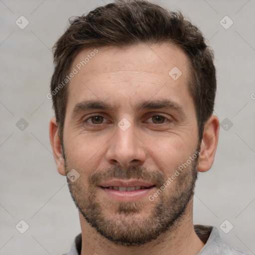 Joyful white adult male with short  brown hair and brown eyes