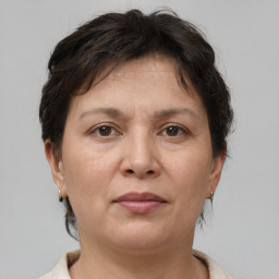 Joyful white adult female with short  brown hair and brown eyes
