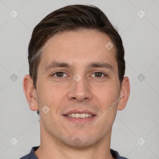 Joyful white adult male with short  brown hair and brown eyes