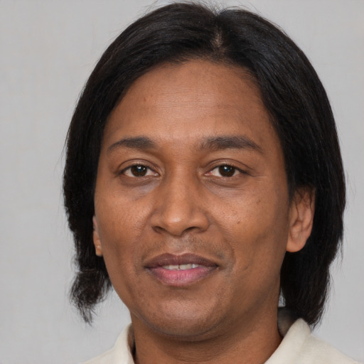 Joyful asian adult male with medium  brown hair and brown eyes