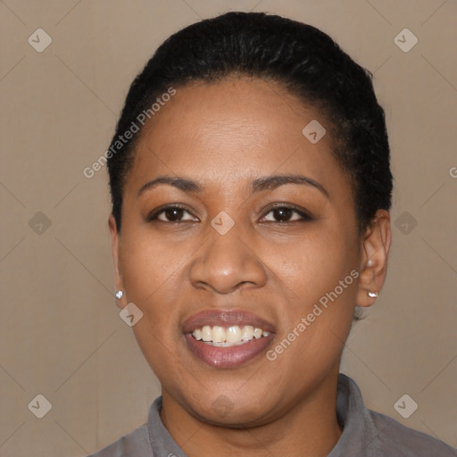 Joyful black young-adult female with short  black hair and brown eyes