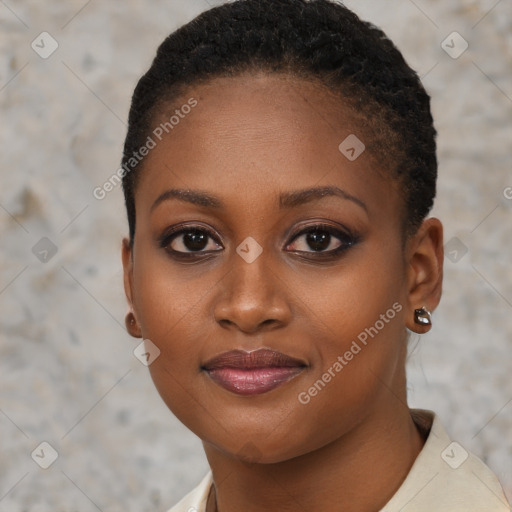 Joyful black young-adult female with short  brown hair and brown eyes