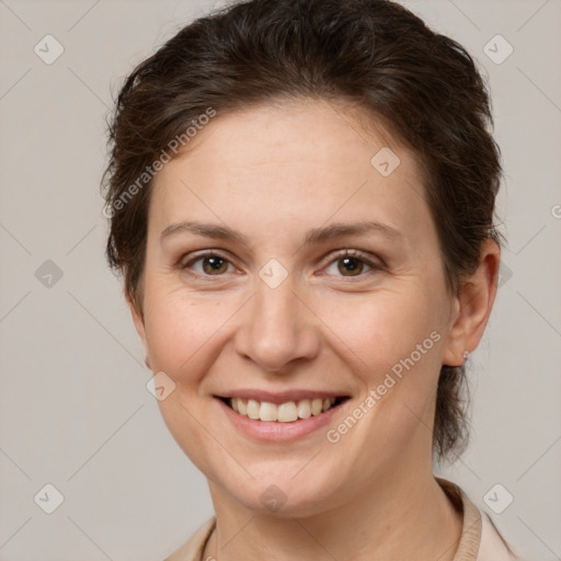 Joyful white adult female with medium  brown hair and brown eyes