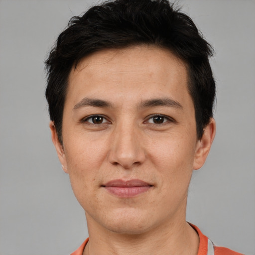 Joyful white adult female with short  brown hair and brown eyes