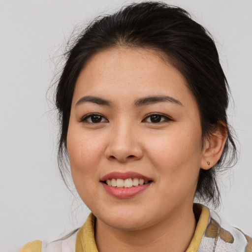 Joyful asian young-adult female with medium  brown hair and brown eyes