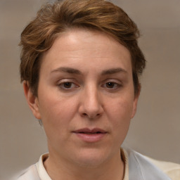 Joyful white adult female with short  brown hair and brown eyes