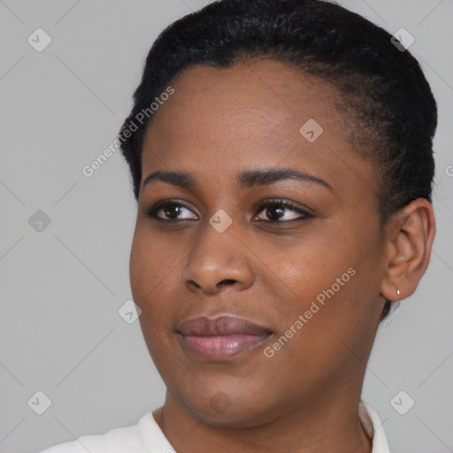 Joyful black young-adult female with short  black hair and brown eyes