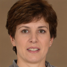 Joyful white adult female with short  brown hair and brown eyes